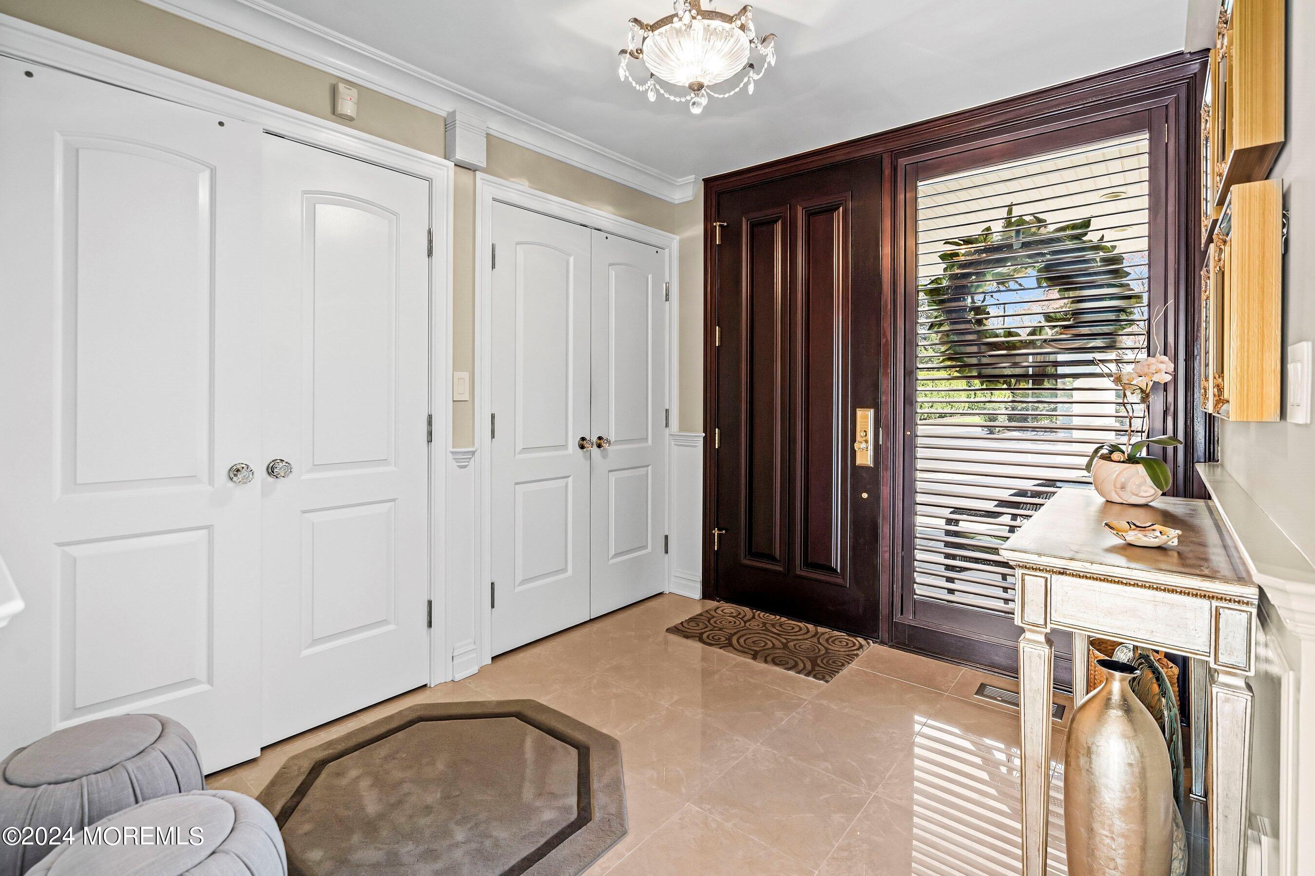 30 Alston Court Red Bank, NJ 07701 - Photo 14 of 103 a bedroom with a bed and a chandelier
