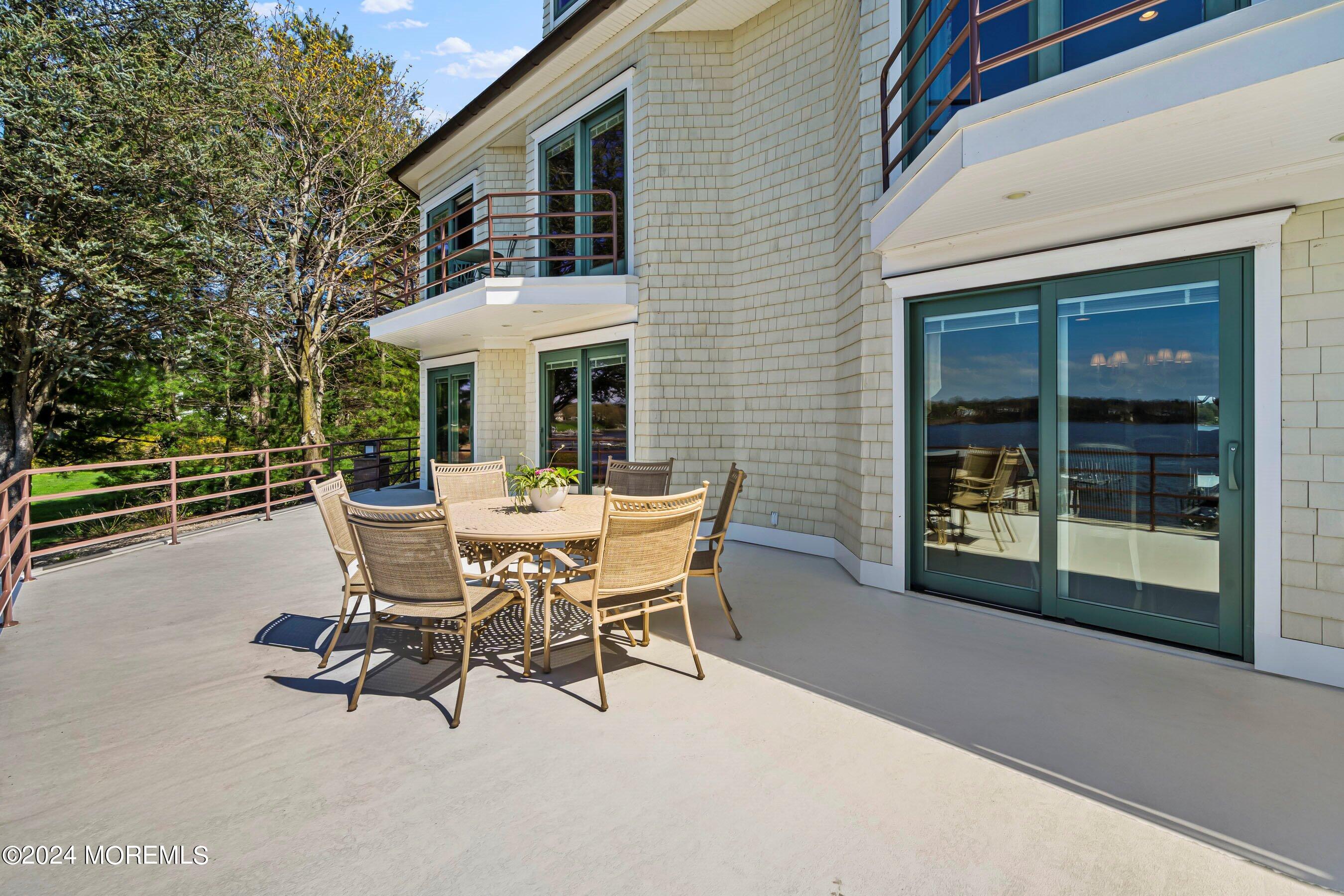30 Alston Court Red Bank, NJ 07701 - Photo 27 of 103 a view of a patio with table and chairs and potted plants