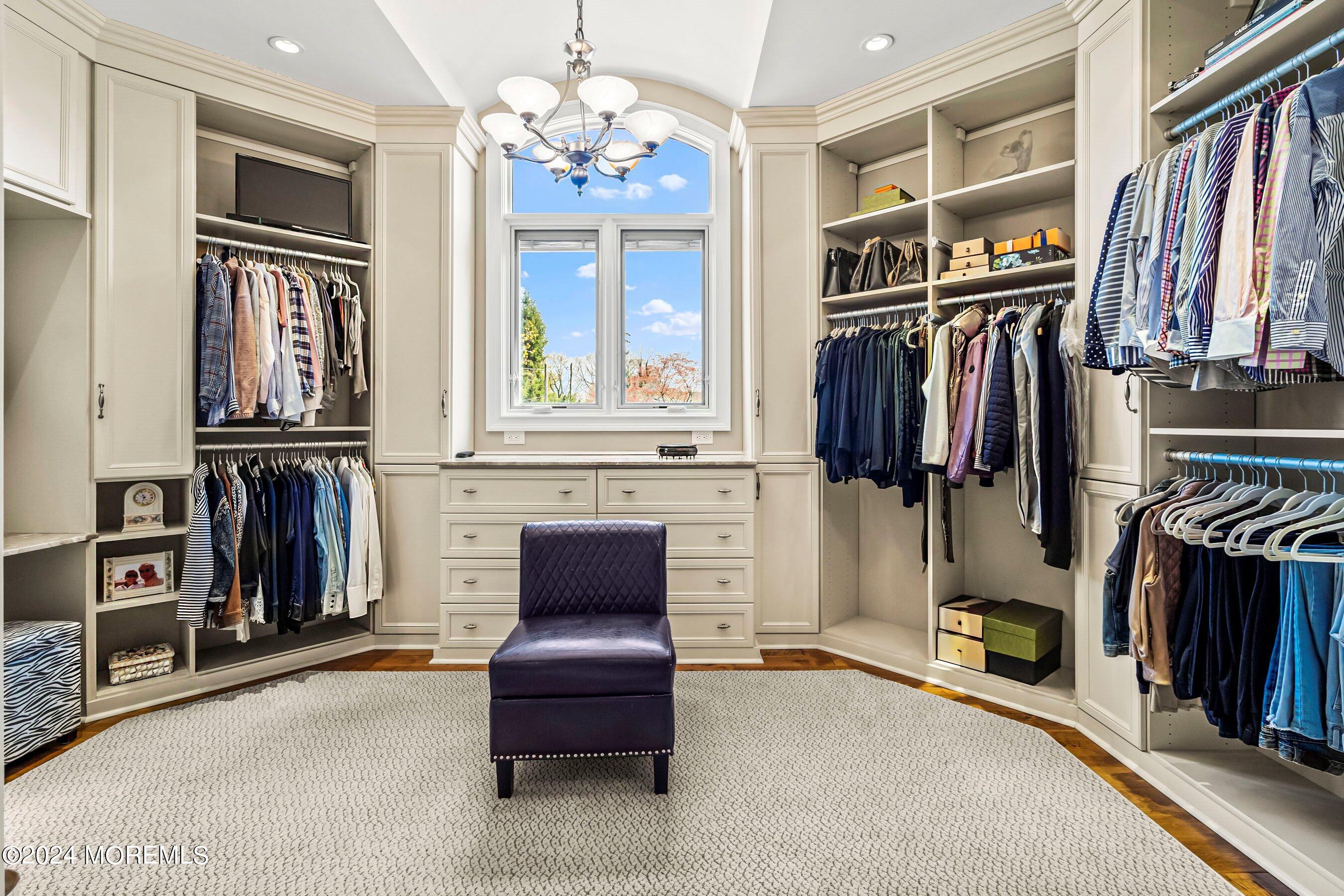 30 Alston Court Red Bank, NJ 07701 - Photo 42 of 103 a view of walk in closet with clothes and shoes