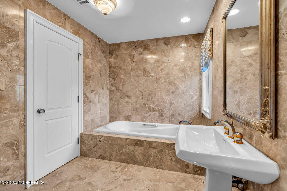 30 Alston Court Red Bank, NJ 07701 - Photo 52 of 103 a bathroom with a bathtub and a sink