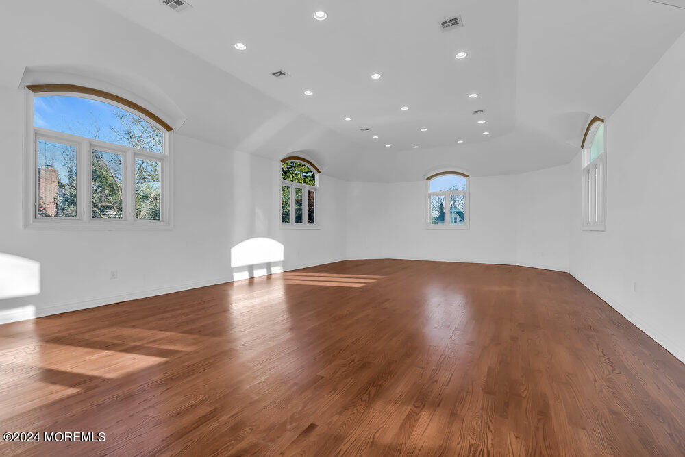 30 Alston Court Red Bank, NJ 07701 - Photo 55 of 103 a view of an empty room with wooden floor and a window