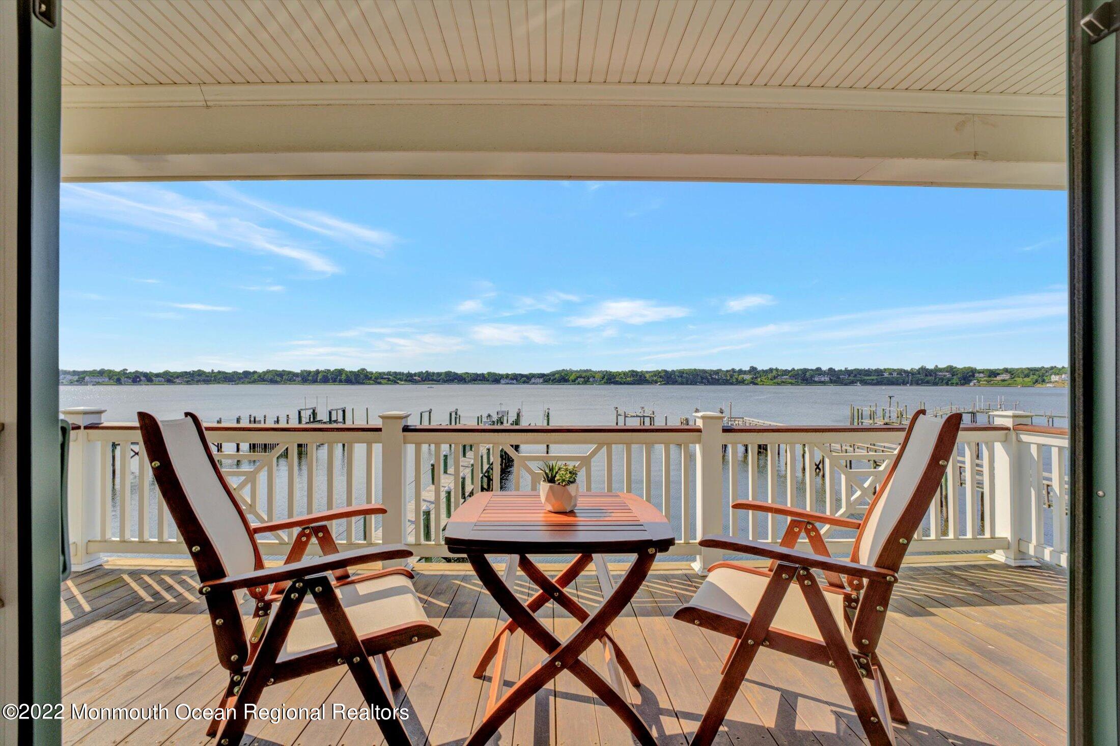30 Alston Court Red Bank, NJ 07701 - Photo 82 of 103 a view of a swimming pool with a table and chairs