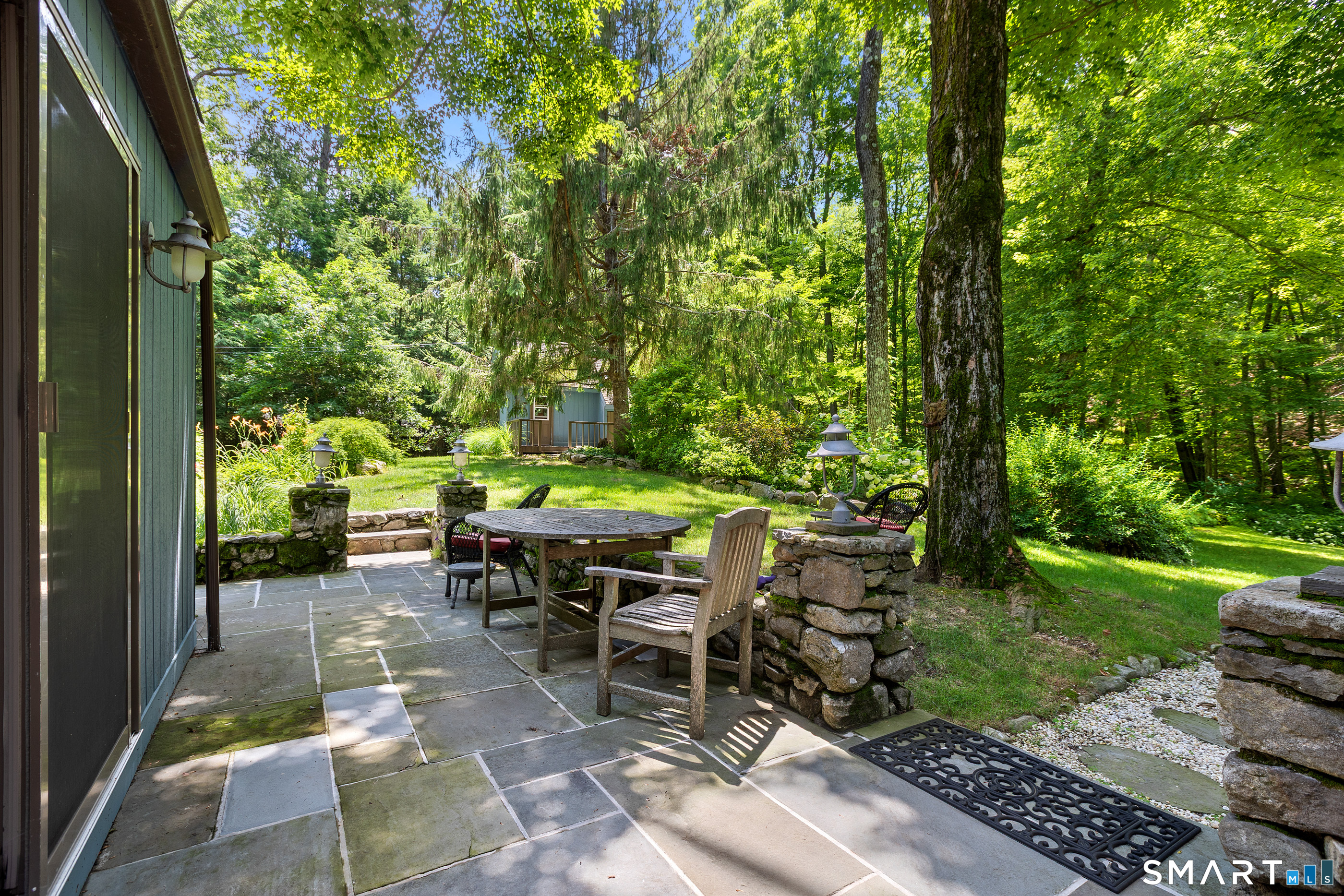 131 Georgetown Road Weston, CT 06883 - Photo 11 of 37 Stone terrace that can be entered from either the Kitchen or Dining Room