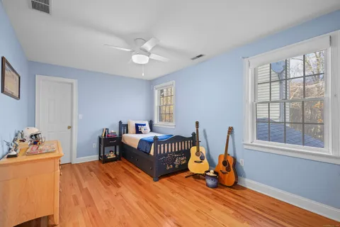 a bedroom with furniture and a window