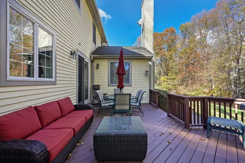 a outdoor living space with furniture and wooden floor