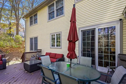 a table and chairs in front of a house