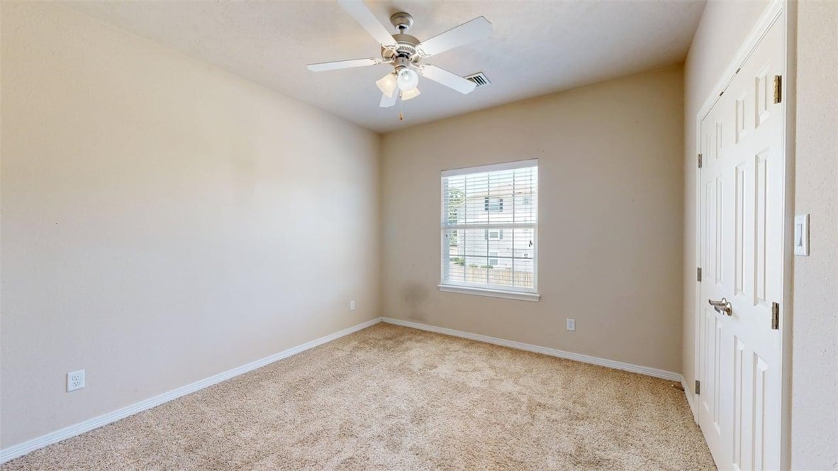 1198 Jones-Butler Road, Unit 2603 College Station, TX 77840 - Photo 20 of 29 an empty room with windows and fan