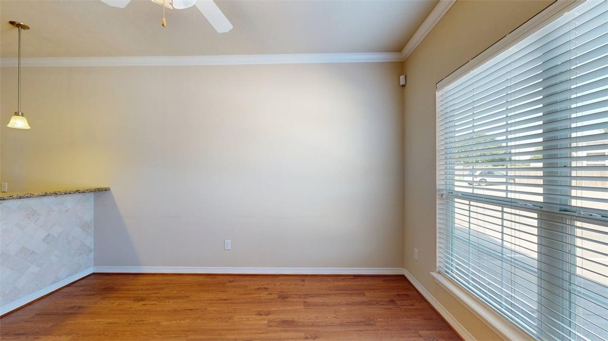 1198 Jones-Butler Road, Unit 2603 College Station, TX 77840 - Photo 2 of 29 a view of an empty room with wooden floor and a window