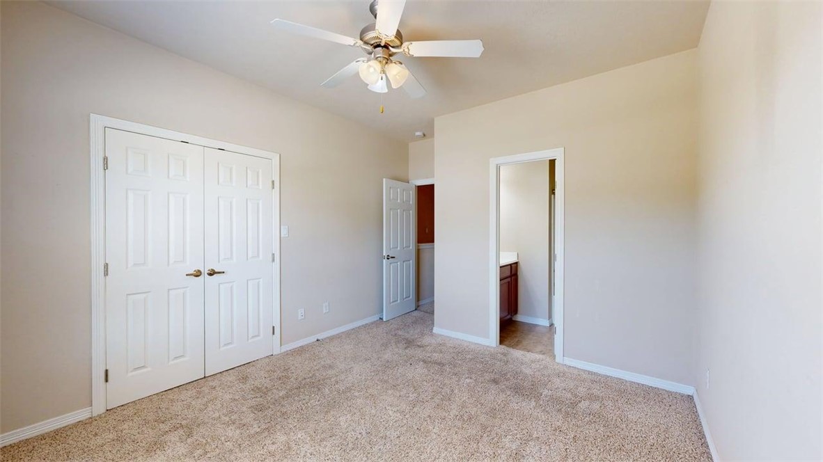 1198 Jones-Butler Road, Unit 2603 College Station, TX 77840 - Photo 21 of 29 a view of a big room with closet and a ceiling fan