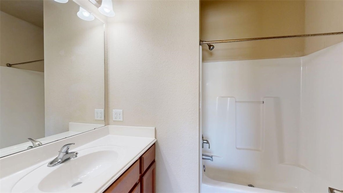 1198 Jones-Butler Road, Unit 2603 College Station, TX 77840 - Photo 22 of 29 a bathroom with a sink and shower