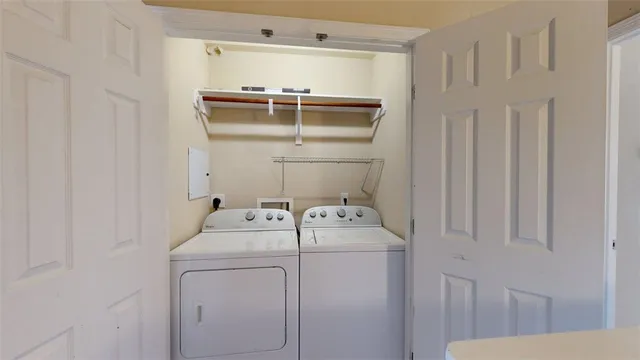 a utility room with dryer and washer