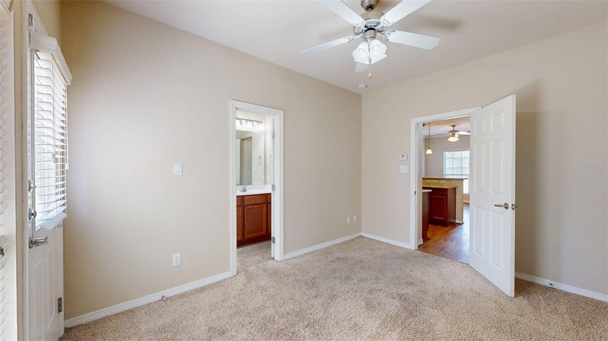1198 Jones-Butler Road, Unit 2603 College Station, TX 77840 - Photo 10 of 29 a view of a room with an entryway and ceiling fan