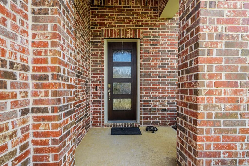 709 Bent Brook Road Oak Point, TX 75068 - Photo 24 of 24 Doorway to property featuring brick siding