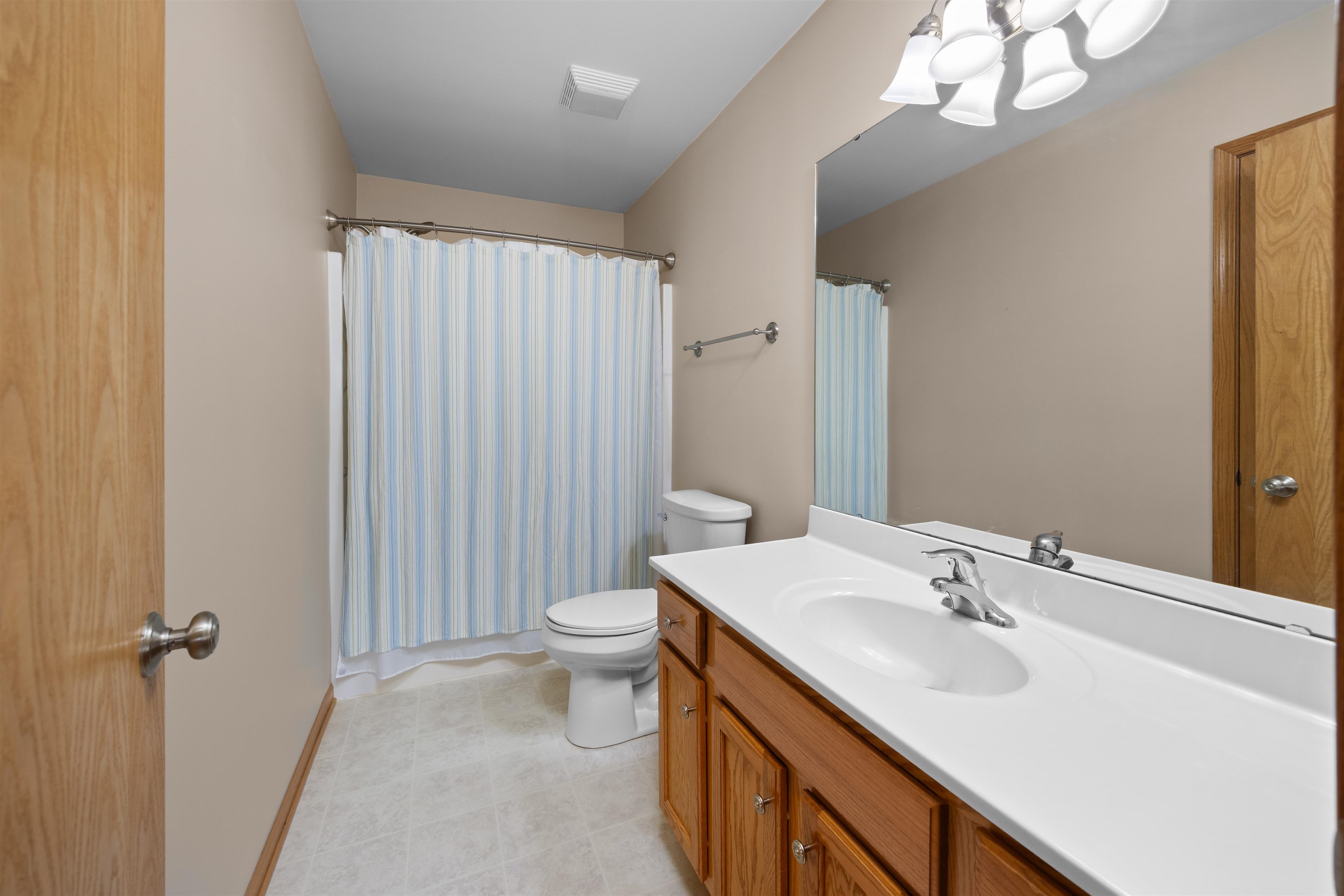 306 Winding Trail Genoa, IL 60135 - Photo 18 of 25 a bathroom with a sink a toilet and shower