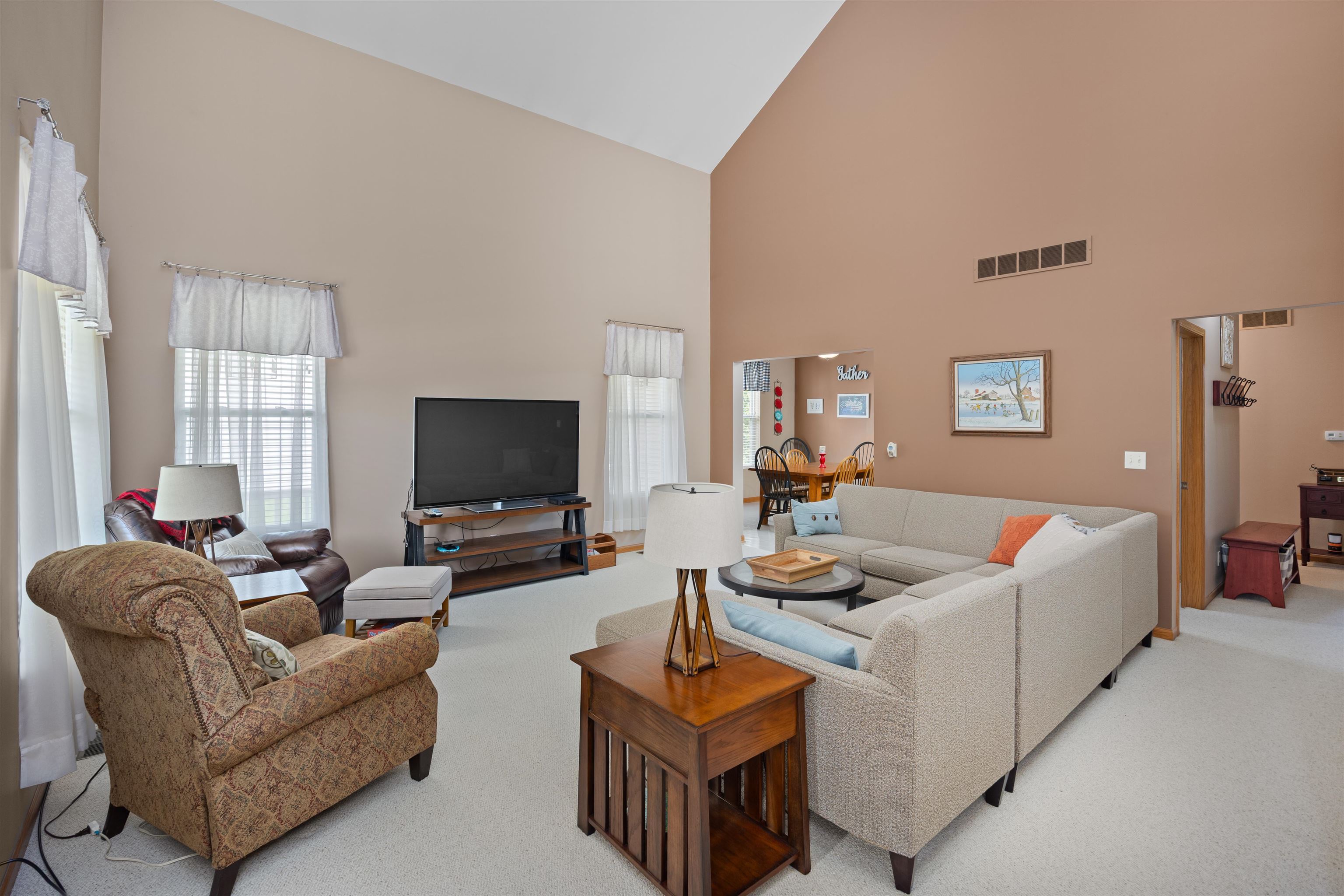 306 Winding Trail Genoa, IL 60135 - Photo 3 of 25 a living room with furniture and a flat screen tv