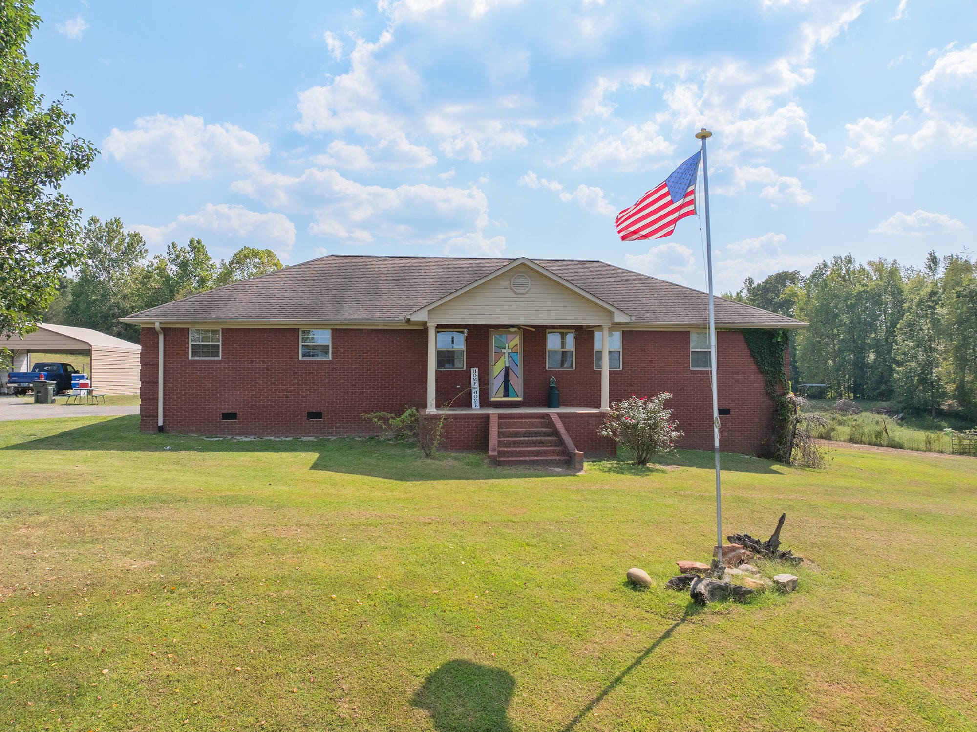 1354 Brandon Road Huntingdon, TN 38344 - Photo 2 of 37 a backyard of a house with table and chairs