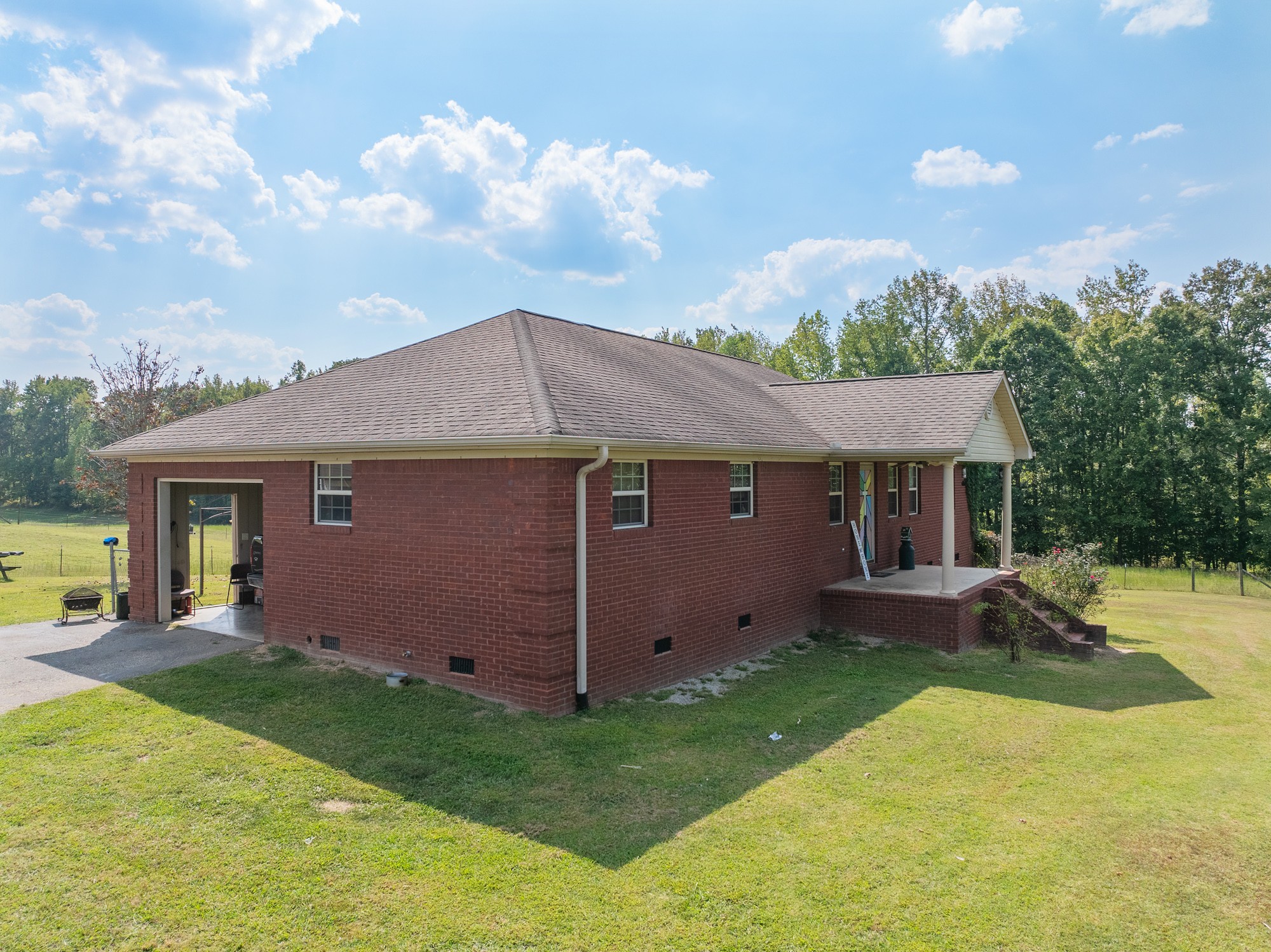 1354 Brandon Road Huntingdon, TN 38344 - Photo 4 of 37 a front view of a house with a yard and garage