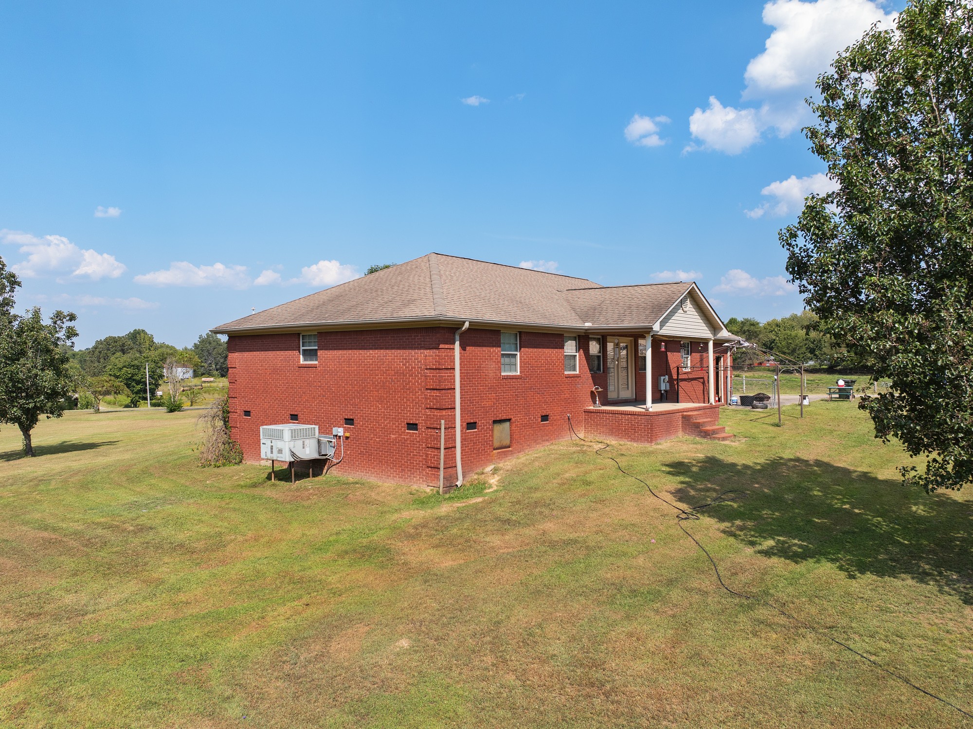 1354 Brandon Road Huntingdon, TN 38344 - Photo 7 of 37 a front view of a house with a yard and garage