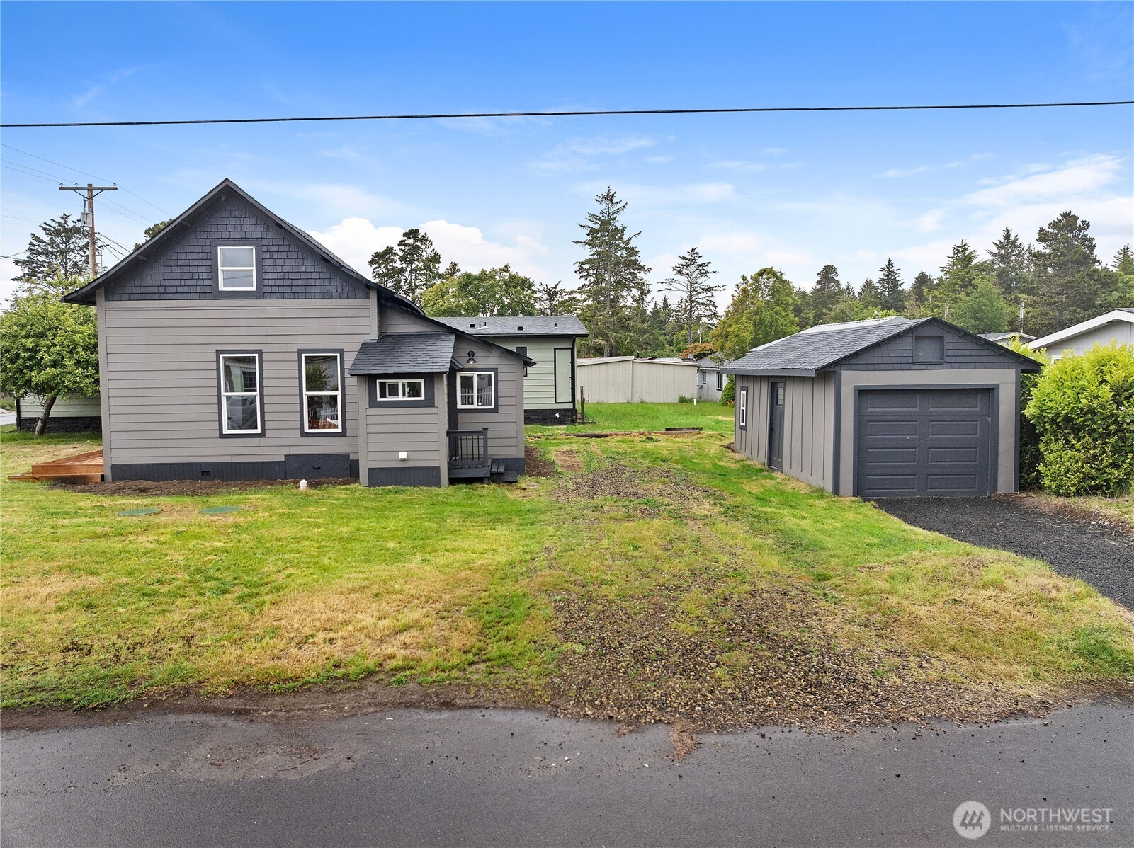 26502 Ridge Avenue Ocean Park, WA 98640 - Photo 22 of 30 a front view of a house with garden