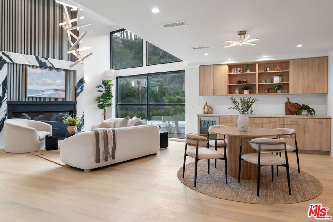 2256 Nichols Canyon Road Los Angeles, CA 90046 - Photo 15 of 45 a dining room with furniture and a large window