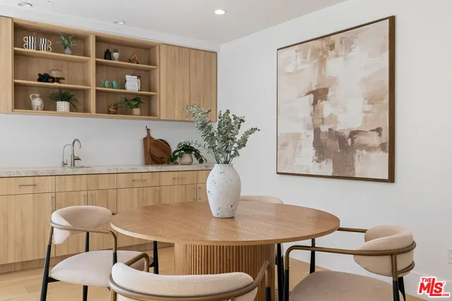 a view of a room that has a table and chair