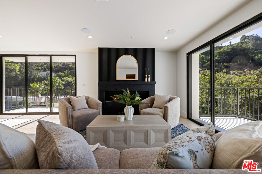 2256 Nichols Canyon Road Los Angeles, CA 90046 - Photo 20 of 45 a living room with furniture and a large window