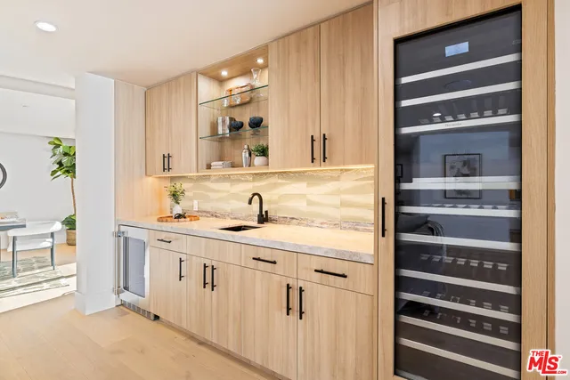 a bathroom with a sink a mirror and a shower