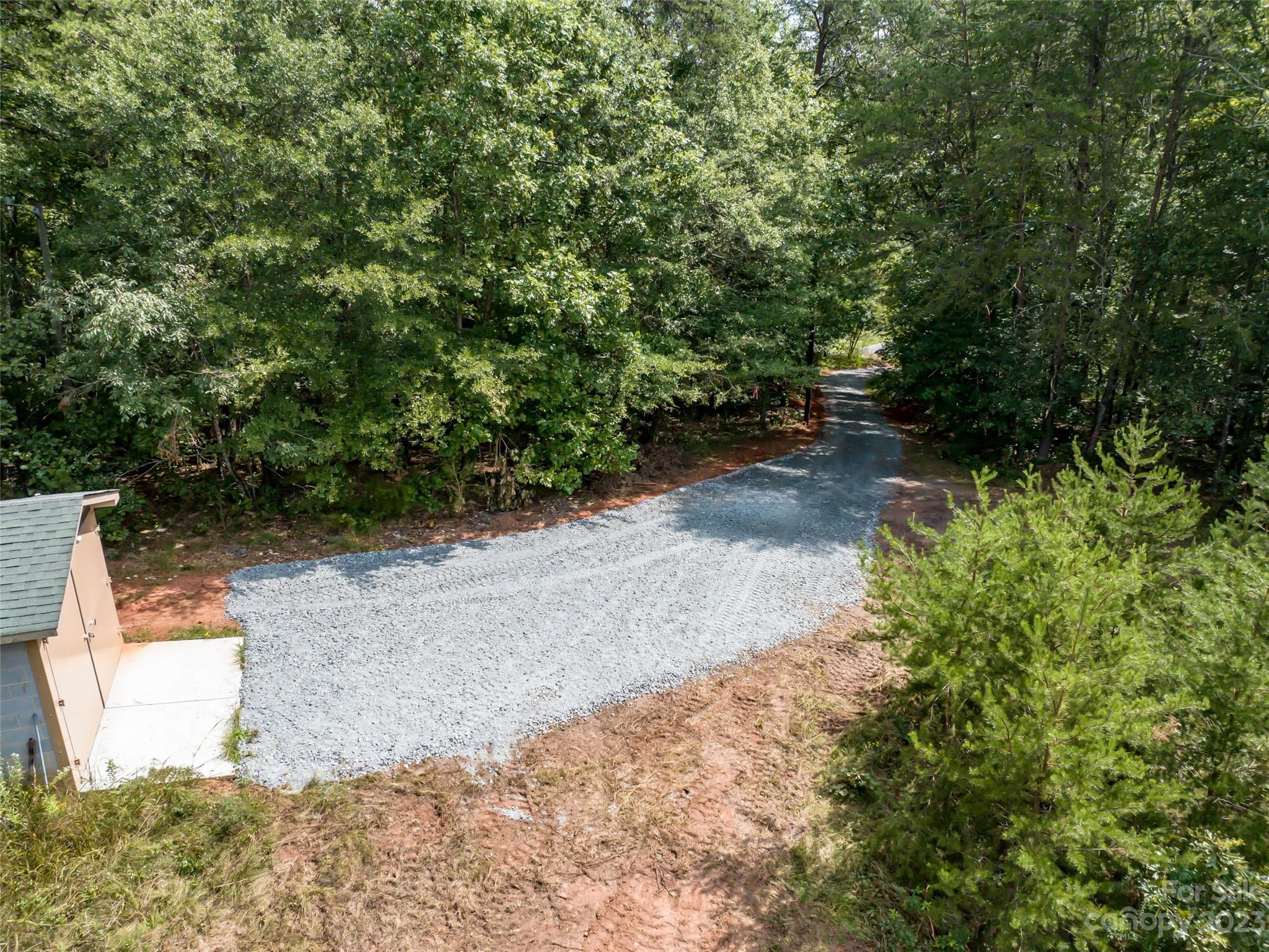 1074 Old Ballpark Road Spindale, NC 28160 - Photo 16 of 20 a view of a yard with plants and a fountain