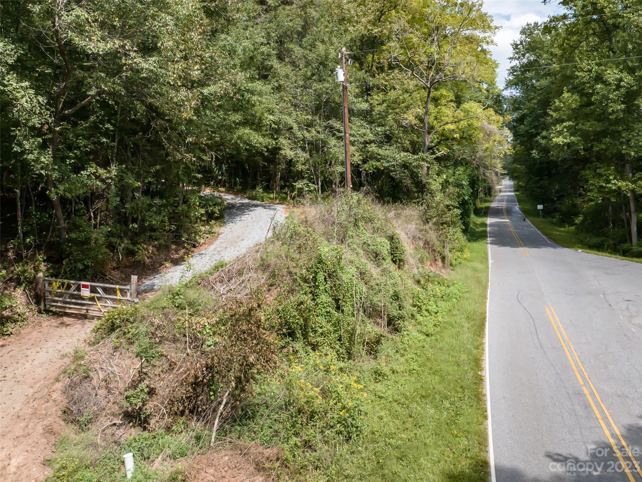 1074 Old Ballpark Road Spindale, NC 28160 - Photo 20 of 20 a view of a yard with plants and large trees