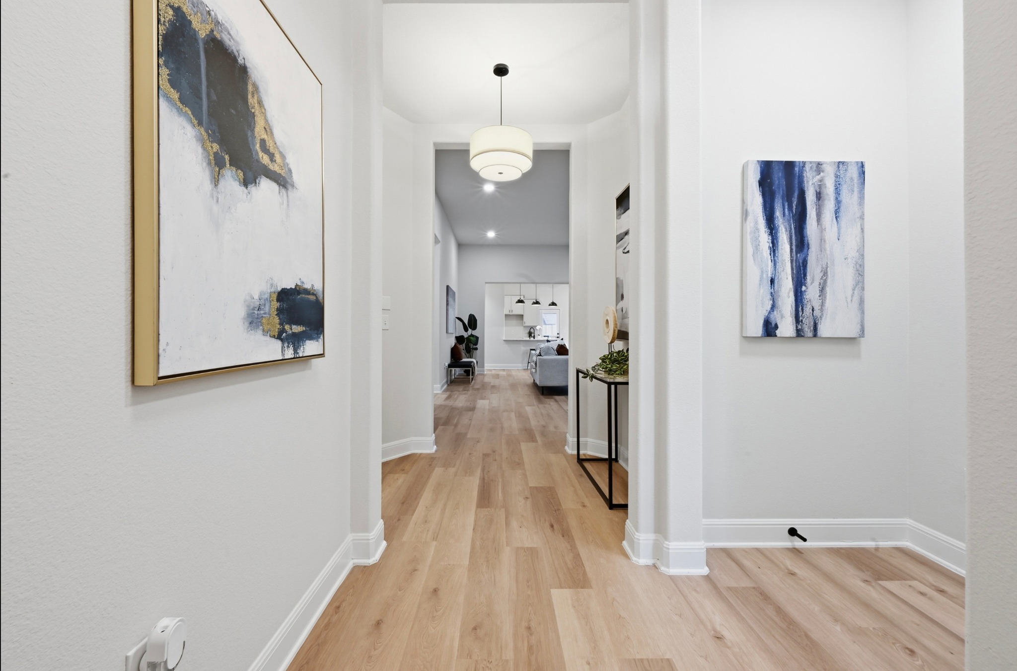 13009 Olivers Way Manchaca, TX 78652 - Photo 7 of 37 a view of a hallway with wooden floor and staircase