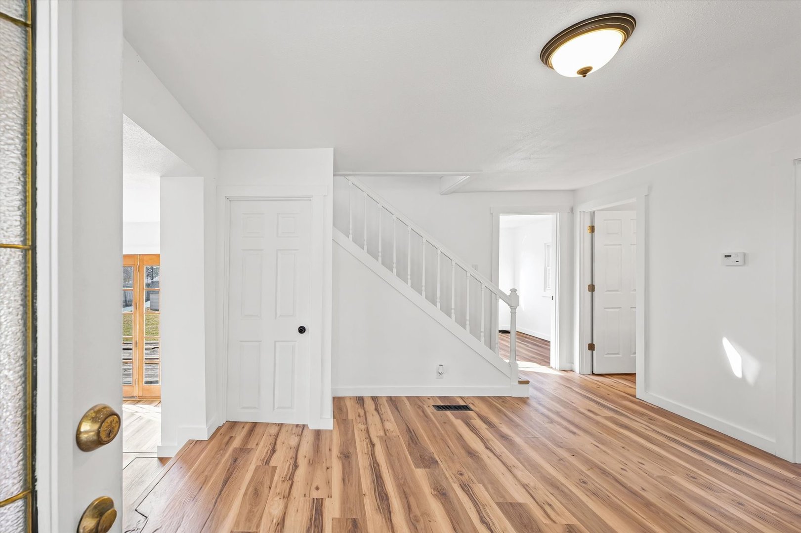 325 North Market Street Hoopeston, IL 60942 - Photo 4 of 35 a view of entryway with wooden floor