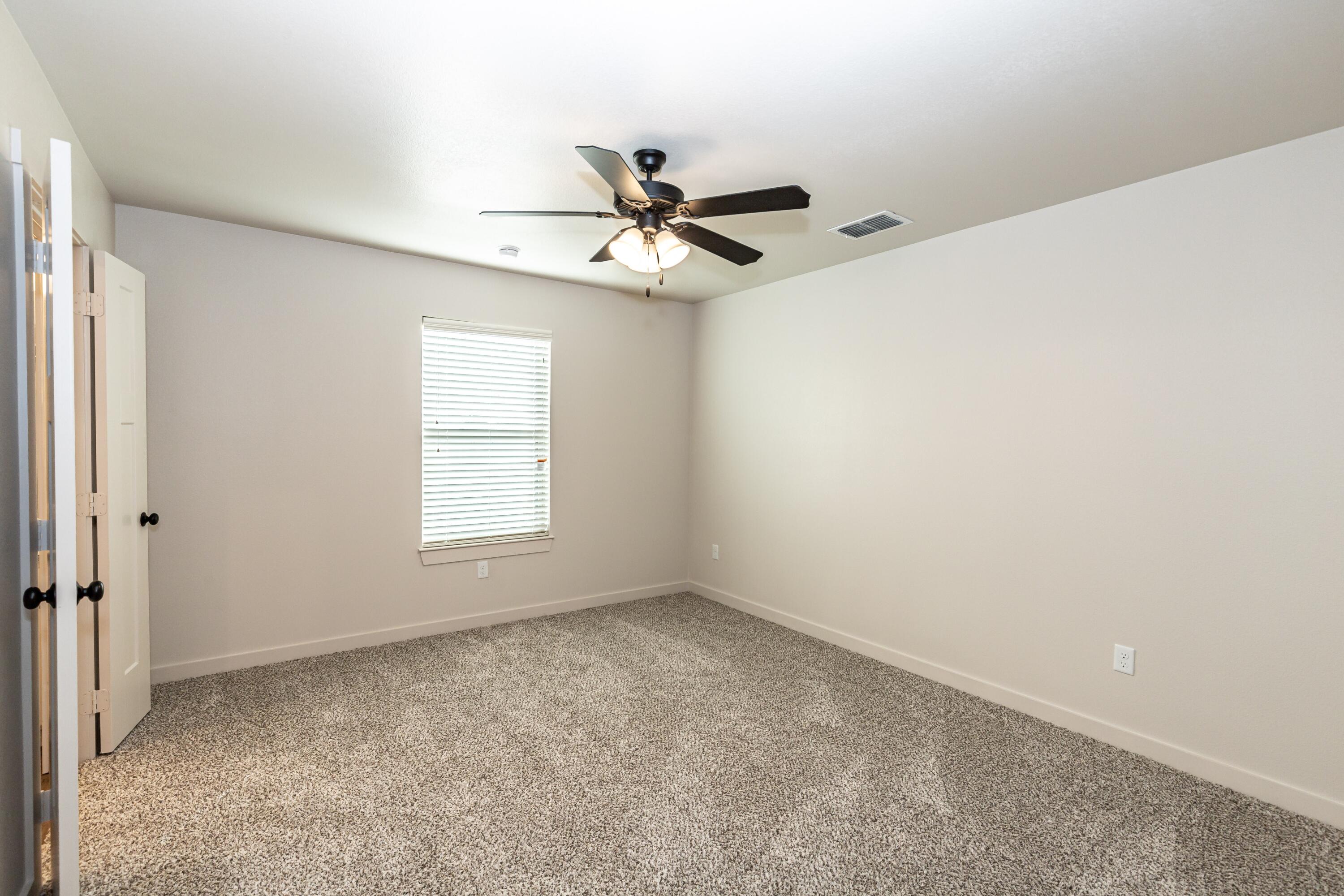 2529 138th Street Lubbock, TX 79423 - Photo 18 of 24 a view of an empty room with a window