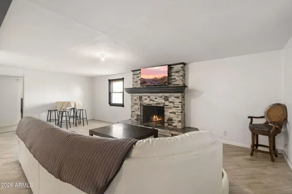 a living room with furniture and a window