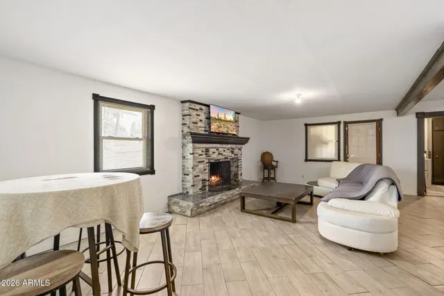 a living room with couch and a table