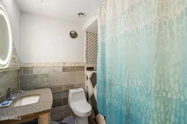 a living room with furniture and flat screen tv