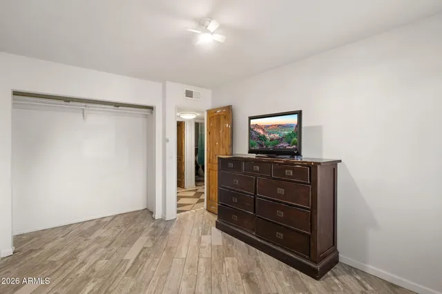 a room with a dresser and a mirror