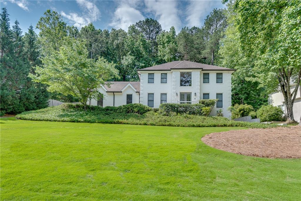 175 Wing Mill Road Atlanta, GA 30350 - Photo 1 of 1 a front view of a house with a yard