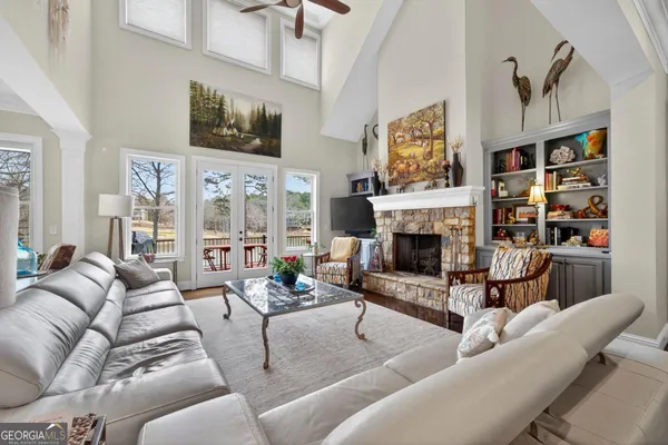 a kitchen with granite countertop a stove a sink and wooden cabinets