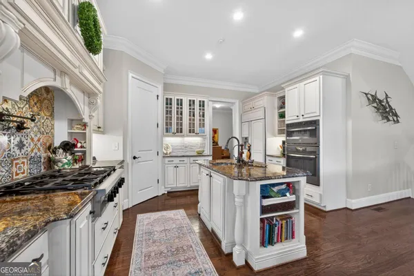 a large bathroom with a sink and a mirror