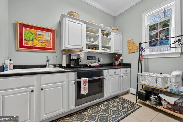 a view of a roof deck with wooden floor and fence