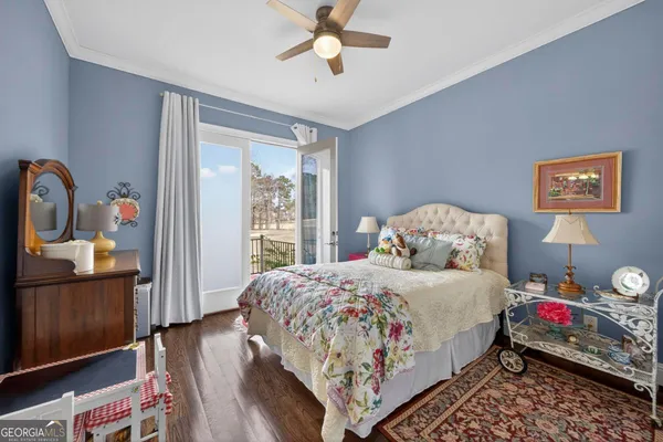 a living room with furniture and a dresser