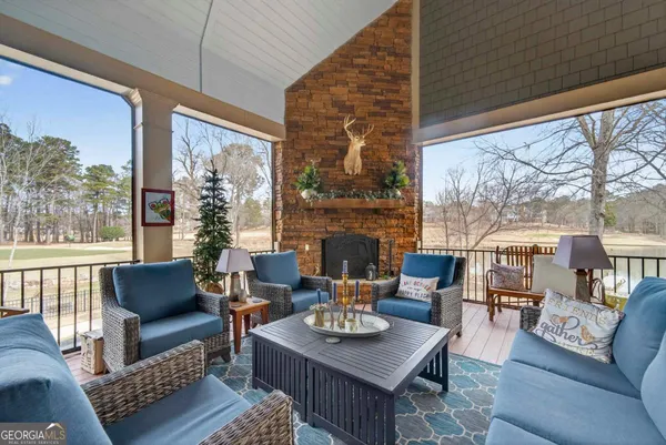 a work room with furniture and a wooden floor