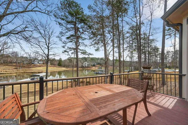 a very nice looking room with many windows and furniture