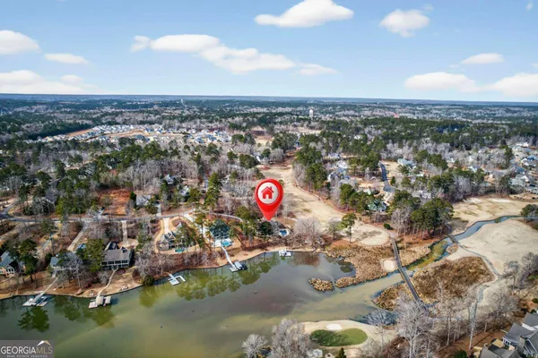 an aerial view of a house with outdoor space