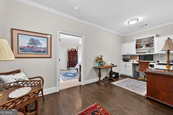 a view of a swimming pool with an outdoor space and seating area