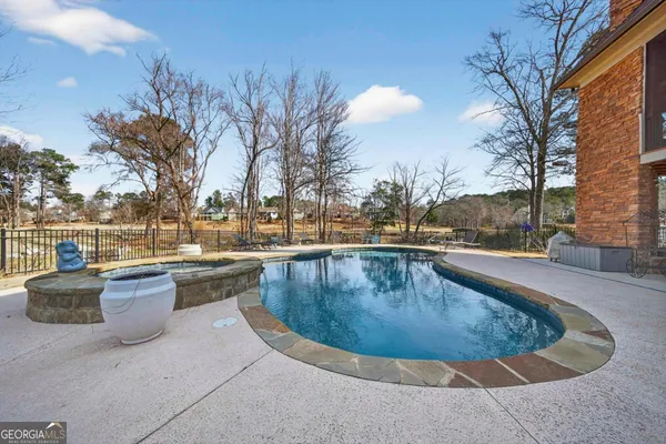 a bedroom with a bed and dresser