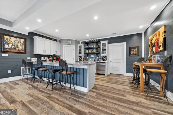 a living room with furniture and a mirror