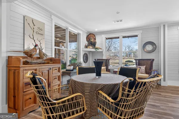 a view of a swimming pool with an outdoor seating