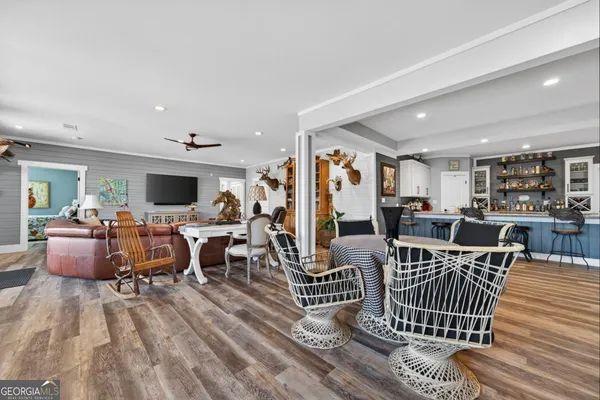 a view of a house with a yard and sitting area