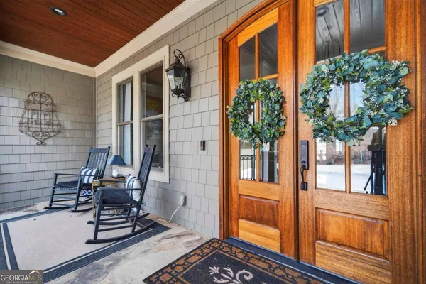 a living room with furniture flower pot and a fireplace